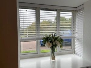 Fauxwood 50mm Venetian blinds fitted to a bay window